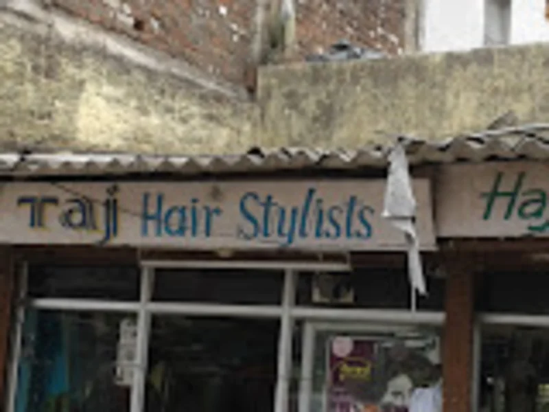 Taj Hair Stylists logo
