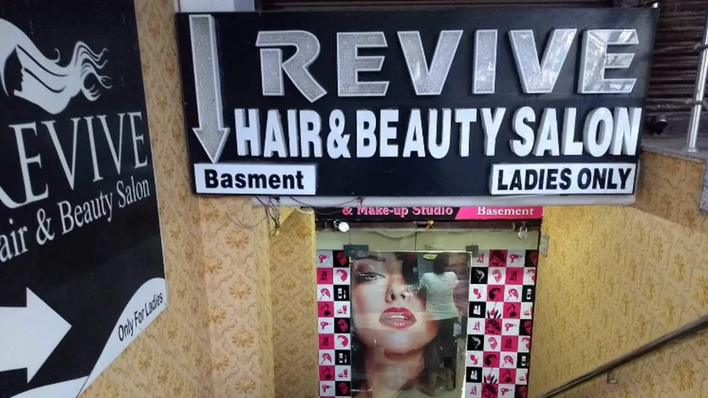 Revive hair beauty salon logo